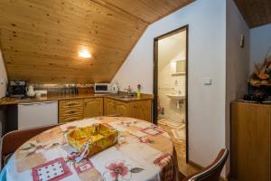 a kitchen with a table with a box on it at Apartmán Milka in Demanovska Dolina