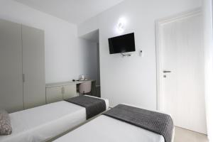 Postel nebo postele na pokoji v ubytování La città del riso