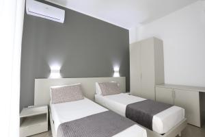 Postel nebo postele na pokoji v ubytování La città del riso