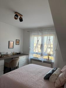 a bedroom with a bed and a window at ERBEX to in Dietzenbach