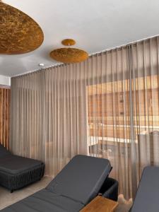 Ένα ή περισσότερα κρεβάτια σε δωμάτιο στο LH Suites Aparthotel NEW OPENING inkl JokerCard
