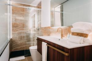 a bathroom with a sink and a shower at Casa Albarari Boutique Double Rooms with access to shared Infinity Pool in Sanxenxo +14 photos