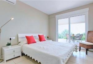 A bed or beds in a room at Luxury Villa at La Sella Resort