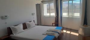Letto o letti in una camera di Cacimba Sunset Lodge