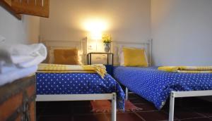 Uma cama ou camas num quarto em Casal Serrano Charme e Tranquilidade