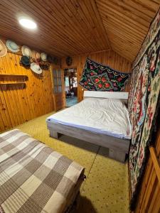 En eller flere senge i et værelse på Casa Santa Maria Bran