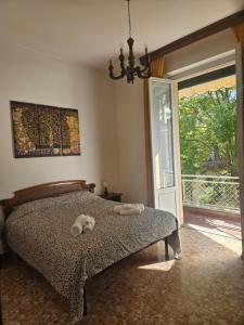 Ένα ή περισσότερα κρεβάτια σε δωμάτιο στο Casa Aida