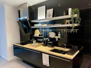 a kitchen with a sink and a counter top at Urban Design Loft in Hamburg +11 photos