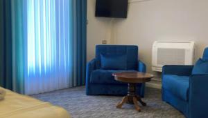 Uma área de estar em Hotel Garni Ideal
