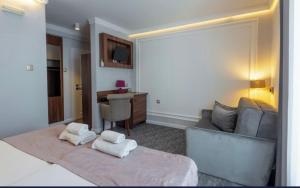Uma cama ou camas num quarto em Hotel Garni Ideal