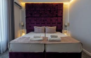 Uma cama ou camas num quarto em Hotel Garni Ideal