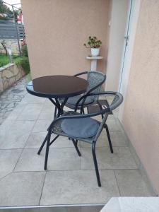 a table and two chairs sitting on a patio at Morena in Pula