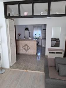 a living room with a couch and a fireplace at Morena in Pula