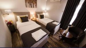 Uma cama ou camas num quarto em Hotel Garni Ideal