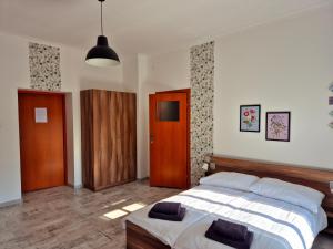 a bedroom with a bed and a wooden door at Villa Kaszubska in Ustka