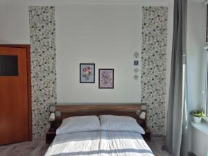 a bedroom with a bed in a room at Villa Kaszubska in Ustka