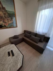 a living room with a couch and a table at Morena in Pula