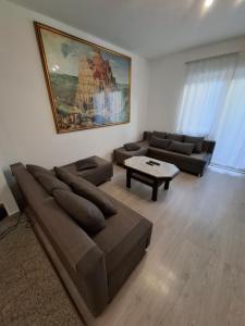 a living room with a couch and a table at Morena in Pula