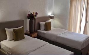 Uma cama ou camas num quarto em Hotel Garni Ideal