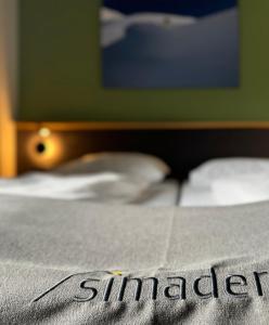 Cama ou camas em um quarto em Hotel Simader