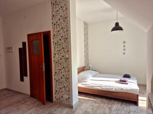 a bedroom with a bed and a door in it at Villa Kaszubska in Ustka +85 photos