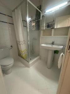 a bathroom with a shower and a toilet and a sink at Elegant maisonette in Pefkohori in Pefkohori