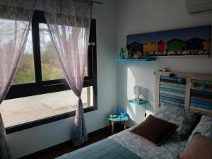 Postel nebo postele na pokoji v ubytování Maison climatisée avec jaccuzi
