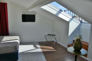 Μια τηλεόραση ή/και κέντρο ψυχαγωγίας στο Charming House - O Mercado