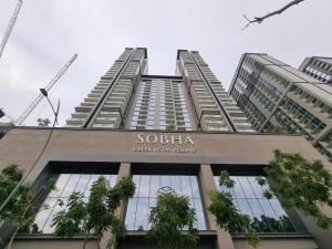 a tall building with a sign on the top of it at Only female ladies only Private room shared bathroom of a residential tower vs pool view & downtown view & pv rooftop parking minimum staying of 5 nights in Dubai