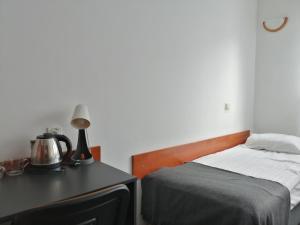 Postel nebo postele na pokoji v ubytování Hotel Dąbrowiak