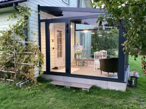a screened in porch of a house at Daisy Lake House in Papsaare