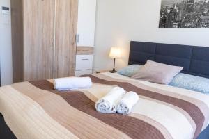 Posteľ alebo postele v izbe v ubytovaní Seaforth Apartment