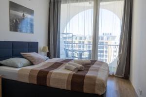 Posteľ alebo postele v izbe v ubytovaní Seaforth Apartment