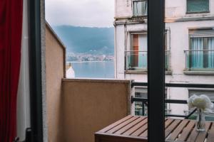 a view of the water from an apartment balcony at Vistas al mar en el centro by CABANA Rentals in Moaña
