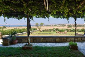 a view from the patio of a house with trees at Villa Panorama in Moúdhros