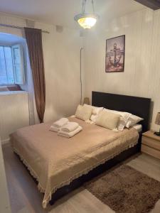 Ένα ή περισσότερα κρεβάτια σε δωμάτιο στο Apartment Calimero +3 φωτογραφίες