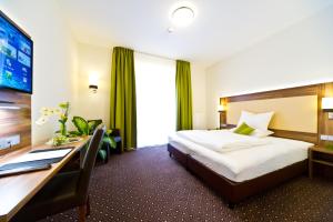 Katil atau katil-katil dalam bilik di Wohlfühl-Hotel Neu Heidelberg