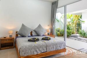 Voodi või voodid majutusasutuse Sumalee 3br - Private Pool & Tropical Garden toas +20 fotot