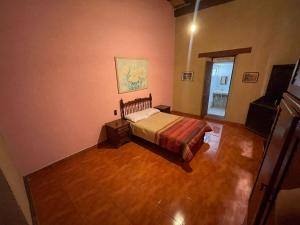 Postel nebo postele na pokoji v ubytování Hacienda Santa Rita