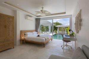En eller flere senge i et værelse på 4BR Villa Private Pool Free Breakfast + 60 billeder