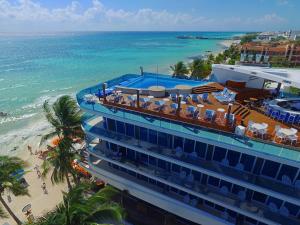 an aerial view of a hotel and the beach at The Carmen Hotel - Ocean Front in Playa del Carmen