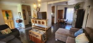 a living room with a couch and a table at The Cozy Corner in Potchefstroom