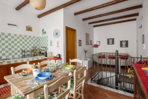 a kitchen and dining room with a table and chairs at Palermo - centro storico in Palermo