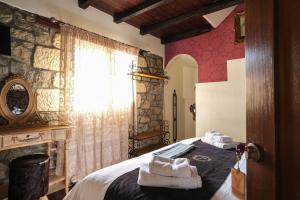 Postel nebo postele na pokoji v ubytování Pindos Resort + 37 fotografií