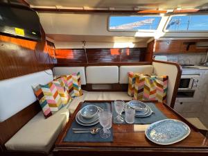 a dining room with a table in a boat at Charming Sailboat in Lisbon