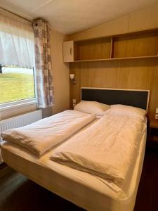 Postel nebo postele na pokoji v ubytování Birkifell II