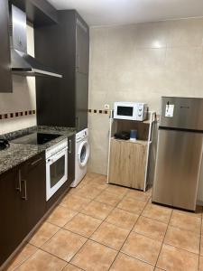 Kuchyň nebo kuchyňský kout v ubytování Apartamento Beiramar