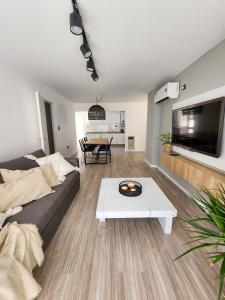 a living room with a couch and a table at Dpto Ituzaingo 1270 - 2 dormitorios in Cordoba