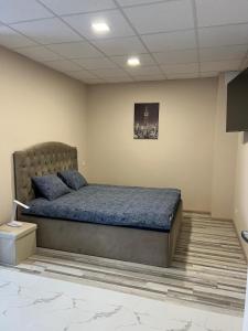 a bedroom with a bed in a room at Brēžas in Valmiera