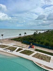 an aerial view of the beach and the ocean at Penthouse Navela 405 by Cercana in Telchac Puerto